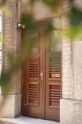 a pair of doors on the side of a building at FS Apartments Kapana Boutique Family Stay in Plovdiv