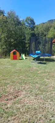 a group of playground equipment in a field at Двете къщи село Бели осъм in Beli Osŭm