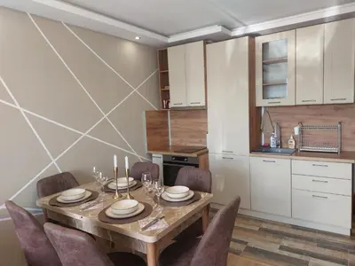 a dining room with a table and chairs in a kitchen at Strumsko Stay in Blagoevgrad