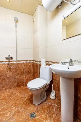 a bathroom with a toilet and a sink at Comfort Corner - 1BD with Balcony by Flat Mаnager in Plovdiv