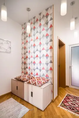a bedroom with a bed in a room with a wall at Alexandra's City Center Apartment I in Sofia