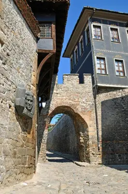 a building with an archway next to a building at Blue House in Plovdiv