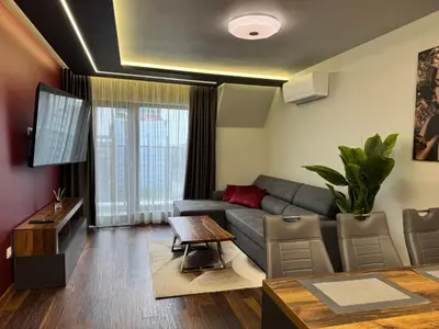 a living room with a couch and a table at Dream Home A21 in Sofia