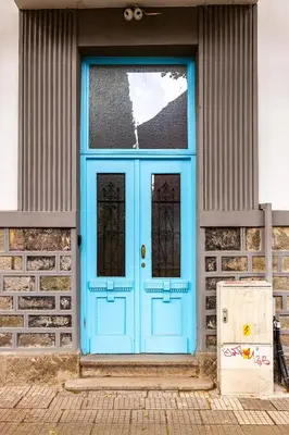 a blue door on the side of a building at Apt Kosmos in the best Central Area in Plovdiv in Plovdiv