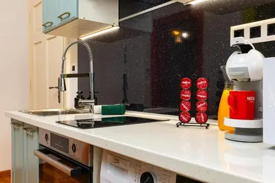a kitchen with a sink and a counter top at Apt Kosmos in the best Central Area in Plovdiv in Plovdiv