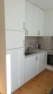 a kitchen with white cabinets and a sink at Sunny and Charming Domain for Your Stay in Sofia in Sofia