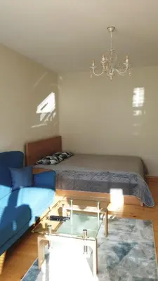 a bedroom with a bed and a glass table at Sunny and Charming Domain for Your Stay in Sofia in Sofia
