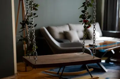 a swing in a living room with a couch at 1 Minute Walk to Main Street Vitoshka, NDK, Free Parking, 2 BDR in Sofia