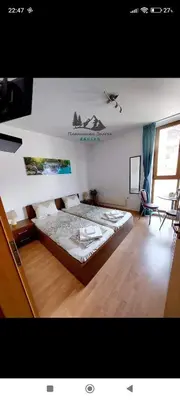 a bedroom with a large bed in a room at Comfy Studio in Bansko