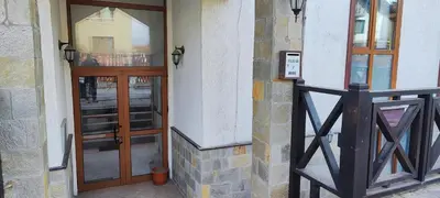 a pair of glass doors on a building at Comfy Studio in Bansko