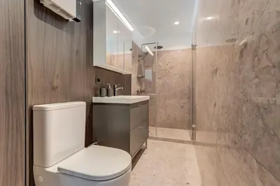 a bathroom with a toilet and a sink and a shower at Modern 1BDMApartment Near Shopping Mall & Metro in Sofia