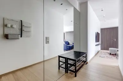 a room with a black desk in a white room at Modern 1BDMApartment Near Shopping Mall & Metro in Sofia