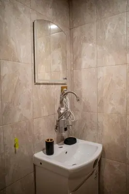 a bathroom with a sink and a mirror at Yaninata Art House in Teteven in Teteven