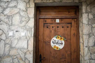 a wooden door with a wreath on it at Yaninata Art House in Teteven in Teteven