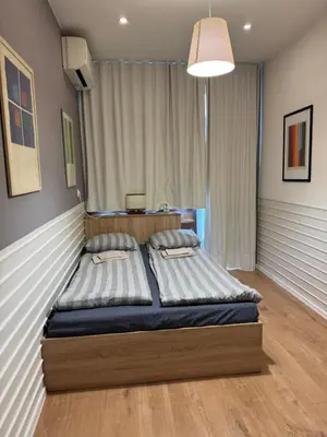 a bedroom with two beds in a room at Happy Day in Sofia