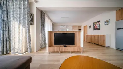a living room with a flat screen tv at Modern & Spacious Stay by Flat Mаnager in Sofia