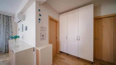 a room with a white cabinet and a staircase at Modern & Spacious Stay by Flat Mаnager in Sofia