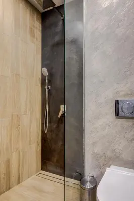 a shower with a glass door in a bathroom at Sophisticated 2BDRM 2BATH and Billiard in Sofia