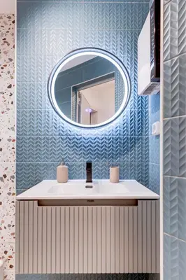 a bathroom with a mirror and a sink at City Gem 1BDRM 200m Sofia Statue in Sofia