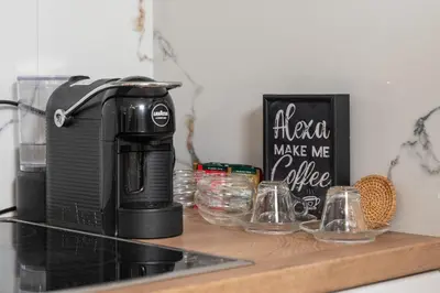 a coffee maker sitting on top of a counter at Бизнес & Арт апартамент - до Панаира и Капана in Plovdiv