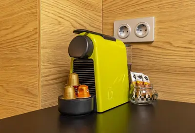 a yellow toaster sitting on top of a table at Downtown Modern Studio with Balcony by Flat Mаnager in Plovdiv