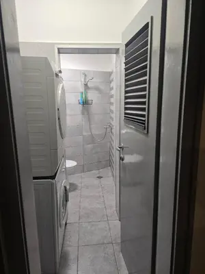a bathroom with a shower and a toilet at Peshtera Cozy Apartment in Peshtera
