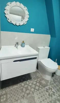 a bathroom with a white sink and a toilet at Magnika in Sapareva Banya