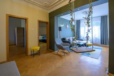 a living room with a couch and a table at 2 DeLuxe Apartments, Top Center Free Parking, 4 BDR in Sofia