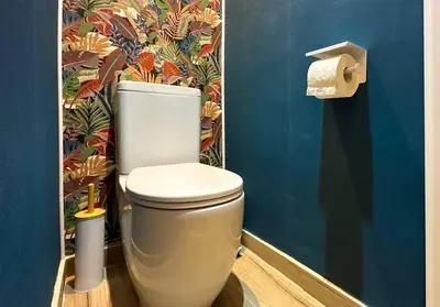 a bathroom with a toilet and a roll of toilet paper at 2BR, 4 Baths, Terrace Steps from Sofia Landmarks in Sofia