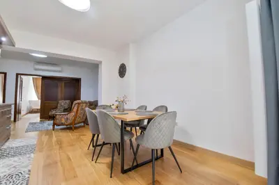 a dining room with a table and chairs at Apartment Central in Plovdiv