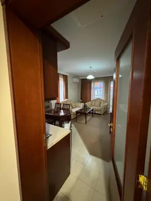 a kitchen and living room with a view of a living room at Gondola Vibes in Bansko