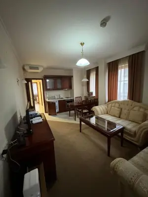 a living room with a couch and a coffee table at Gondola Vibes in Bansko