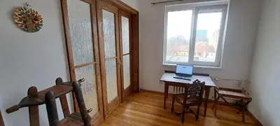 a room with a desk and a window and a laptop at Bright apartment in Doktorska gradina in Sofia
