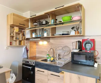 a small kitchen with a sink and a microwave at Moderno Studio Park Lane in Bansko