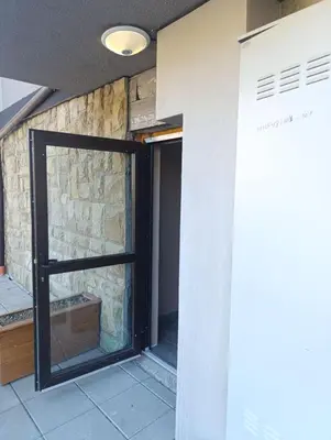 a door to a room with a stone wall at Moderno Studio Park Lane in Bansko