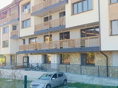 a car parked in front of a building at Moderno Studio Park Lane in Bansko