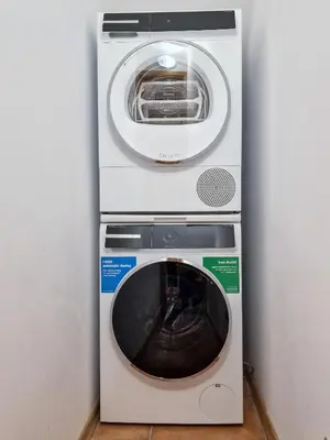 a washing machine and a dryer in a wall at Aquaterra Villa with Hot Pool - Banya in Banya