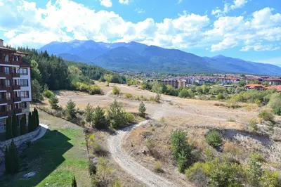 arial view of a town with mountains in the background at Charming Studio with Mountain View - Bansko by Flat Mаnаger in Bansko
