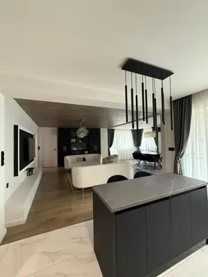 a large living room with a couch and a table at Grand Trio Apartment in Plovdiv