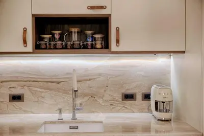 a kitchen counter with a sink and a toaster at Luxury and stylish apartment in the heart of the city in Sofia