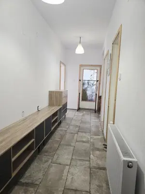 an empty room with a hallway with a long counter at Слънчев апартамент 44 ет 3 in Sandanski