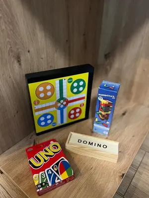 a table with two boxes of dominoes and a book at Urban Hive - Central Designer Studio in Lozenets in Sofia