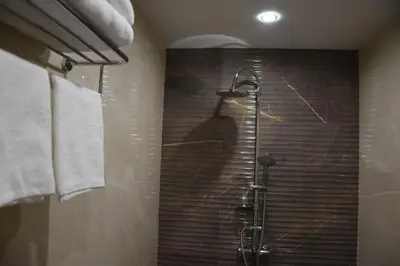 a shower stall with a shadow of a person at Zlati`s house 1 in Sofia
