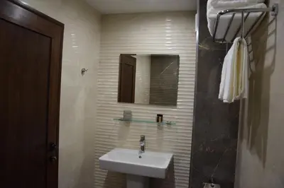a bathroom with a sink and a mirror at Zlati`s house 1 in Sofia