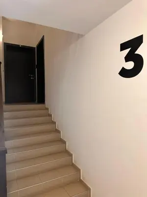 a set of stairs with a number three on the wall at Private large apartment in Iglika 2 for 4 people in Borovets