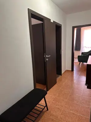 a room with a door and a bench in it at Private large apartment in Iglika 2 for 4 people in Borovets