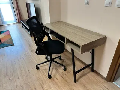 a desk with a black chair in an office at Winslow Highland escape apartment in Bansko