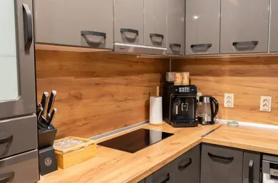 a kitchen with a counter top with a coffee maker at All Seasons Plovdiv - Fast Wi-Fi, AC, Balconies in Plovdiv