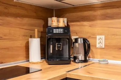a coffeemaker sitting on top of a kitchen counter at All Seasons Plovdiv - Fast Wi-Fi, AC, Balconies in Plovdiv