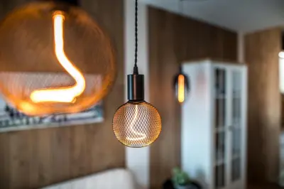 a couple of lights hanging in a room at ARHEYA 2 apart АРХЕЯ 2 апартамент за гости in Karlovo